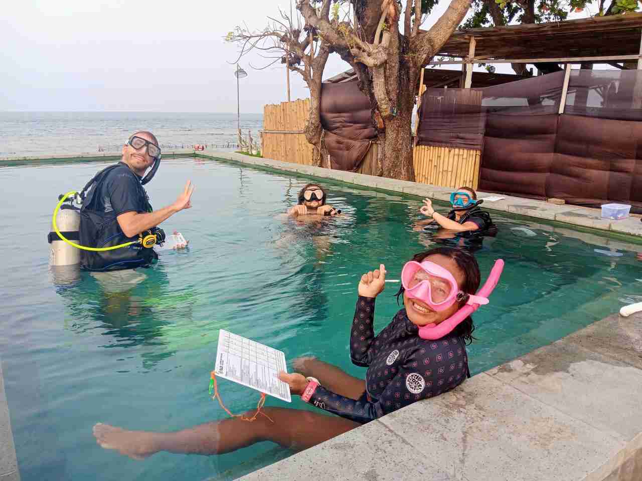 PADI IDC candidates and their Course Director in the training pool at Two Fish Divers, Indonesia